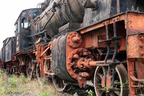 Preview: Old steamed locomotive in a junkyard