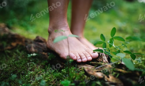 Preview: Bare feet of man standing barefoot outdoors in nature, grounding concept
