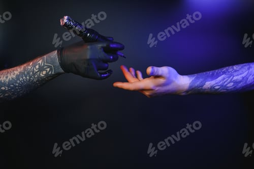 Preview: Close up cropped photo of tattooer master artist male hold in hand machine black ink in jar