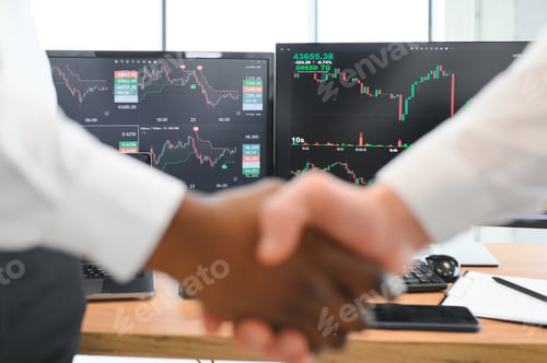 Preview: Investor stock trading of business partners shaking hands against screen for cooperating