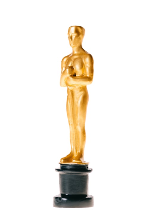 Preview: KYIV, UKRAINE - JANUARY 10, 2019: shiny golden oscar award isolated on white