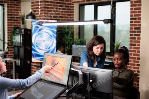 Preview: 3D graphics designers in creative agency office workspace developing video game project.