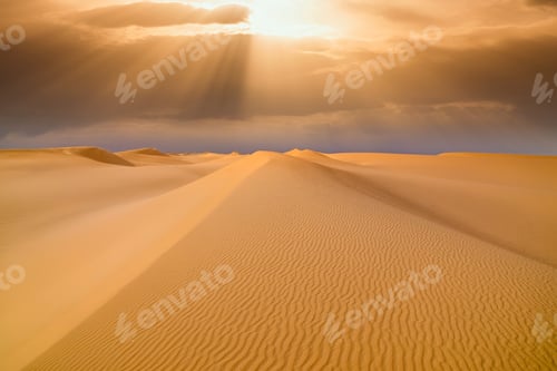 Preview: Sunset over the sand dunes in the desert. Arid landscape of the Sahara desert.