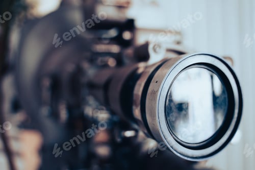 Preview: closeup of vintage theatre projector lens