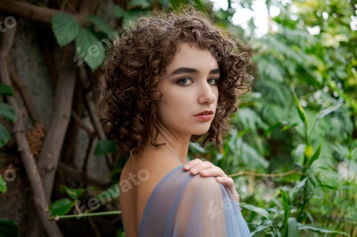 Preview: Woman with brown hair and a blue dress