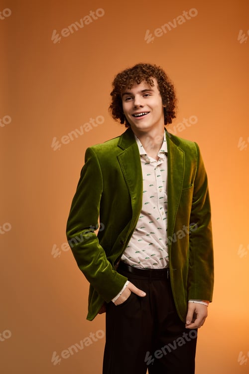 Preview: Curly teenager shines in green velvet blazer during vibrant studio session