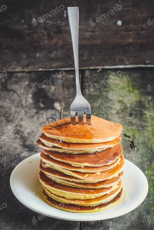 Preview: Pancakes In A Plate On A Wooden Table With Honey (Fritters)