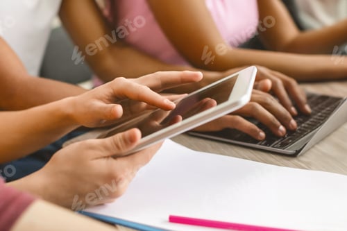Preview: Student using tablet for studying, turning page