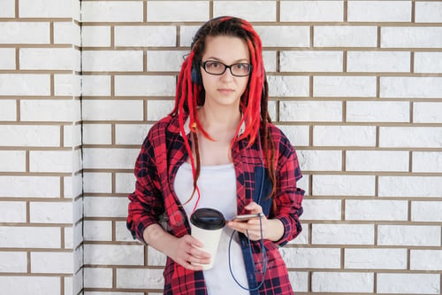 Preview: Hipster Girl Listening To Music With Headphones, Drinking Coffee To Go And Rewrite In Social