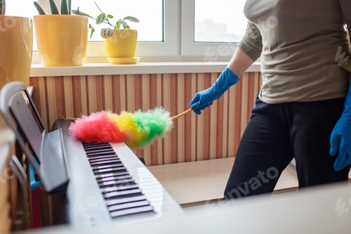 Preview: Woman cleans home, wipes dust from the piano and dreams about music, authentic inner life