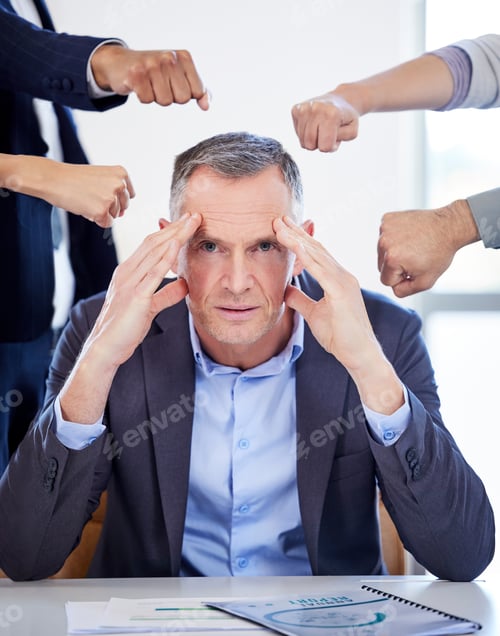 Preview: Portrait of a mature businessman looking stressed out in a demanding office environment
