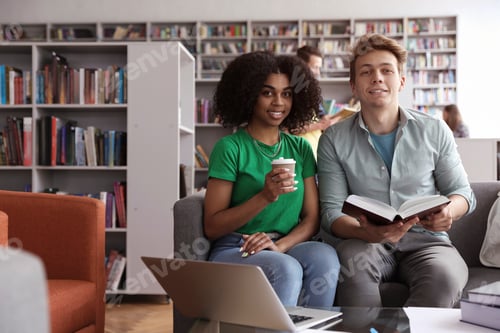 Preview: Group of young people studying in library