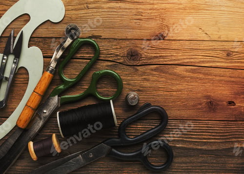 Preview: Wooden table with assorted tools scattered across the surface, with copy space