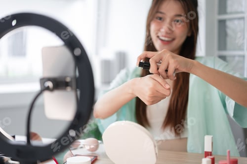 Preview: Woman Applies Foundation in Front of Ring Light