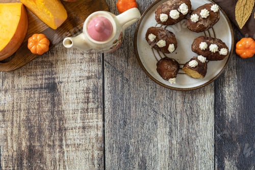 Preview: Chocolate rum potato cake with pumpkin on rustic background, homemade vegan dessert.