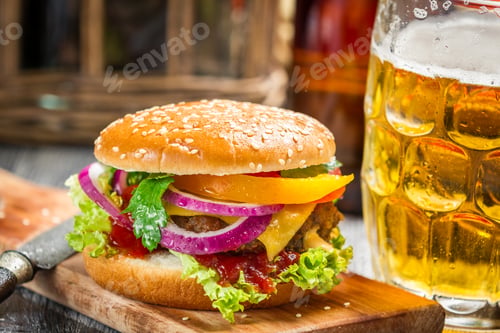 Preview: Closeup of fresh burger and a cold beer