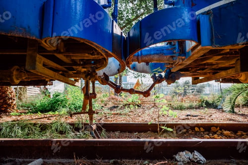 Preview: Two abandoned train cars linked by their links.
