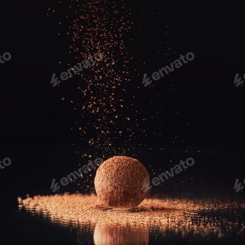 Preview: close up view of sweet truffle candy with cocoa powder on black