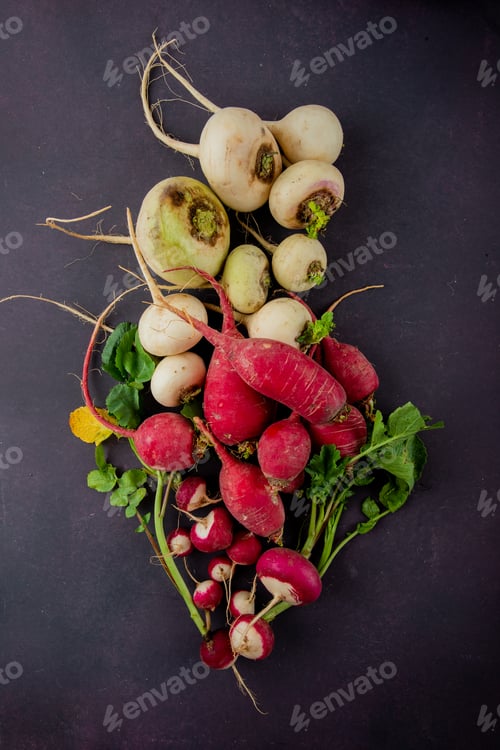 Preview: top view of red and white radishes on maroon background