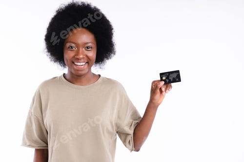 Preview: African-american teenage girl holding a credit card isolated in white background