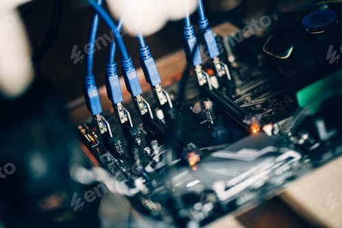 Preview: Cryptocurrency mining rig, details of computer motherboard and cables, graphics card and processor