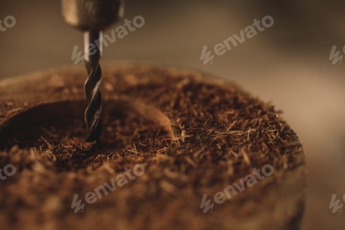 Preview: Close-up of drill bit in the piece of wood