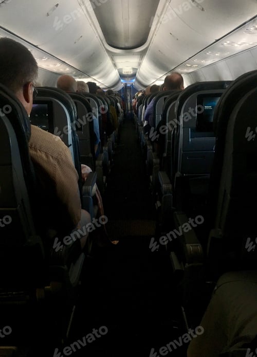 Preview: Looking down the aisle of a Full airplane
