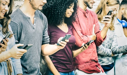 Preview: Multicultural friends group using mobile smart phone