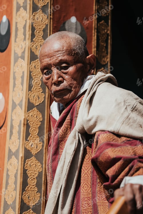 Preview: Elderly Bhutanese worshiper at Tshechu festival