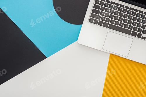 Preview: top view of laptop on abstract geometric background