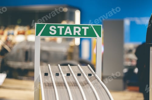 Preview: Closeup shot of the sing START on the green background