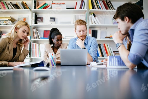 Preview: Businesspeople working in clean white office