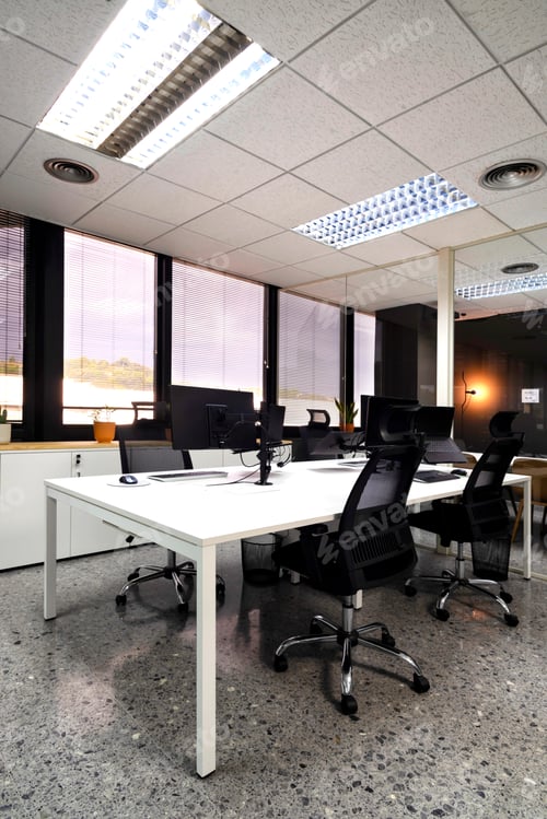 Preview: modern open space office with computer monitors on white desks