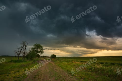 Preview: Storm clouds , dramatic dark sky over the rural field landscape