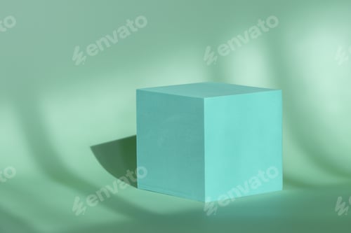 Preview: Minimalist blue cubic pedestal for branding and packaging with natural room shadows. Geometrical