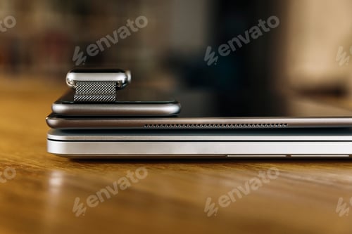 Preview: Stack of mobile devices on table top
