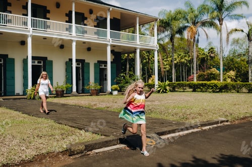 Preview: a little girl with her mother runs around the Botanical Garden on the Paradise island of Mauritius