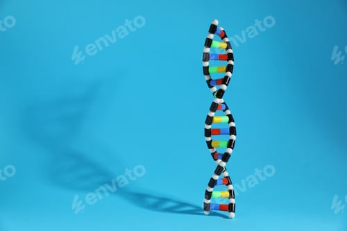 Preview: Colorful DNA structure model on light blue background. Space for text