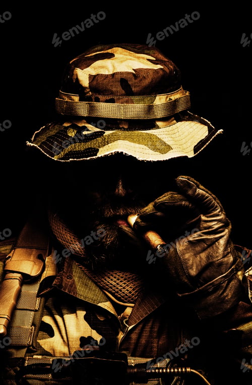 Preview: Commando soldier in boonie hat smoking cigar