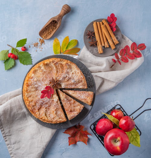 Preview: aromatic homemade apple pie with red apple and cinnamon on wood blue table autumn