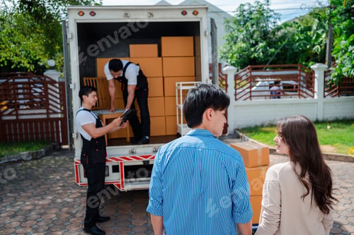 Preview: Asian Couple check while unloading boxes and furniture from a pickup truck