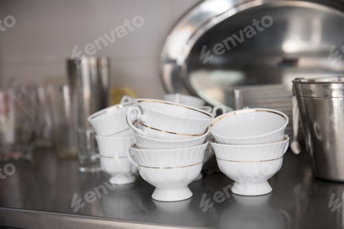 Preview: close-up shot of stacked clean tableware at restaurant