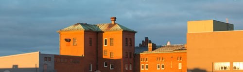 Preview: Panoramic shot of buildings with a blue sky in the background at daytime