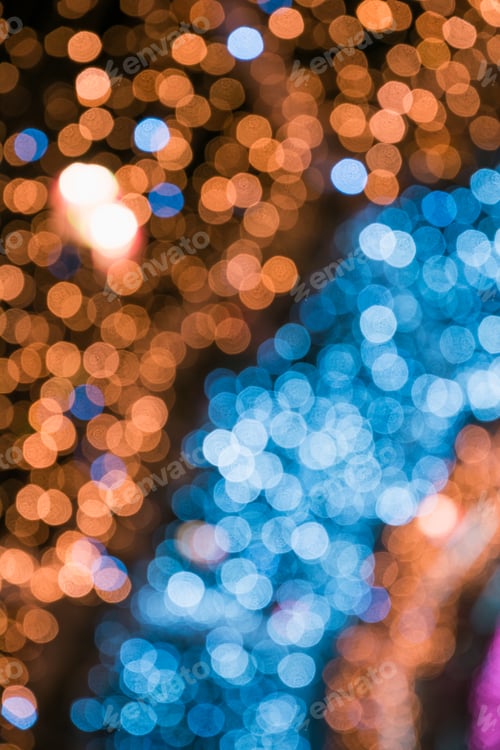 Preview: Blurred blue garland. City night light blur bokeh, defocused background. Christmas abstract.