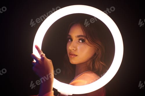 Preview: Young Woman Posing with Neon Light