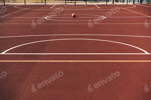 Preview: Ready to play? Shot of basketball ball lying on the empty basketball playground outdoors