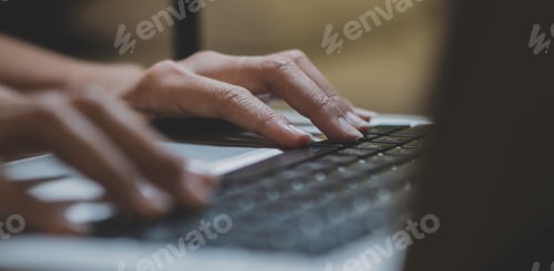Preview: close up hand working on laptop