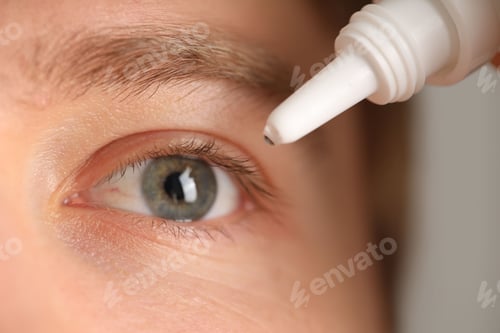 Preview: Man applying eye drops on blurred background, closeup