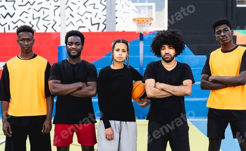 Preview: Group of multiracial people having fun playing basketball outdoor - Urban sport lifestyle concept