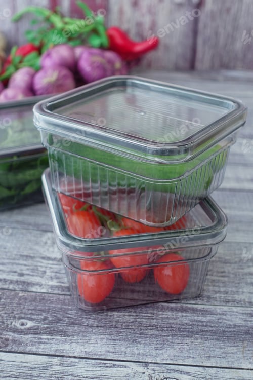 Preview: Clear containers of fresh veggies on wood surface